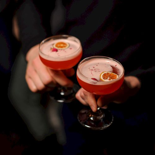 Assorted nigiri sushi pieces on a dark plate with rice and toppings, creating a colorful, bite-sized assortment.